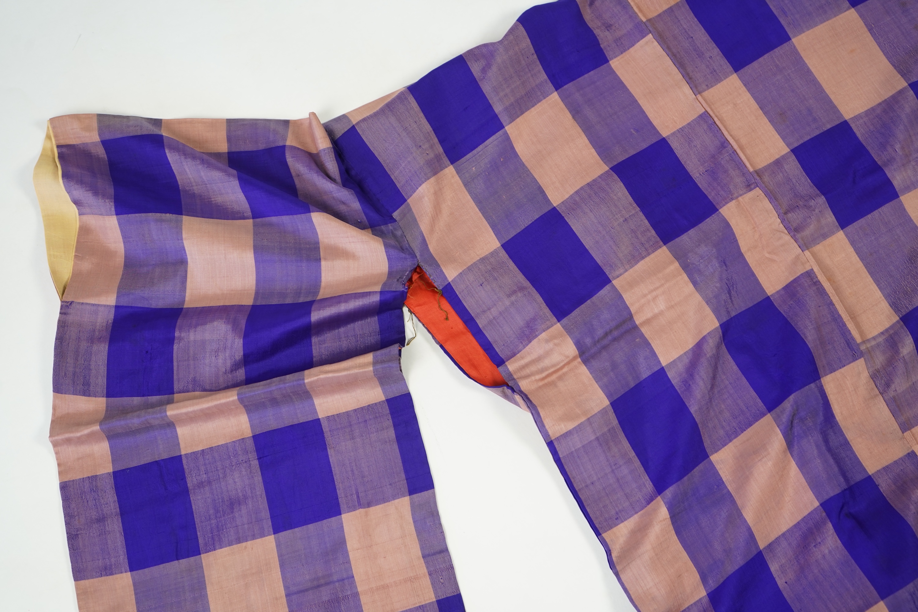 Four 1930’s - 1950’s printed silk full length silk lined Japanese kimonos. Two floral and two geometric in design. Longest black and orange floral designed kimono, 150cm long. Condition - purple and pink check kimono the